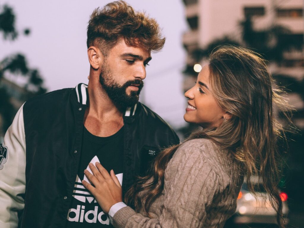 Couple is looking at each other with smiling face