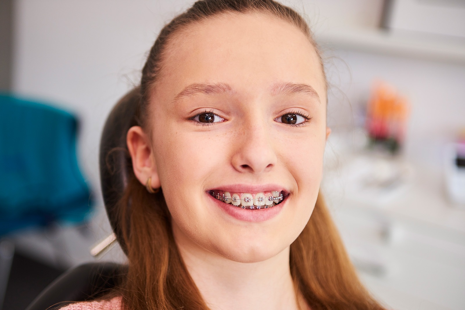 Smiling child patient with braces